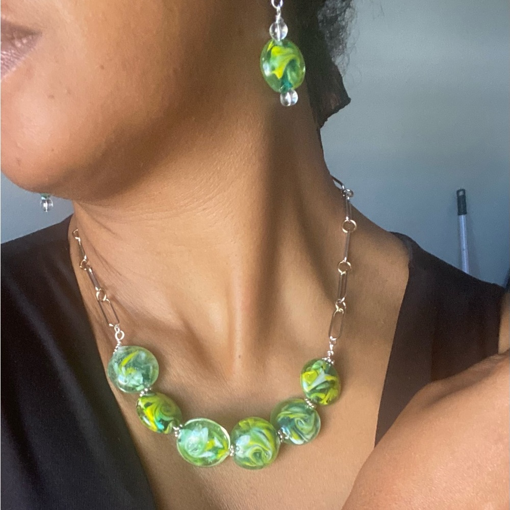 Green beaded necklace, earrings, and bracelet set.